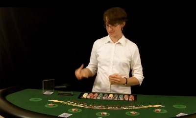 The dealer is holding the deck correctly The dealer is holding the deck correctly