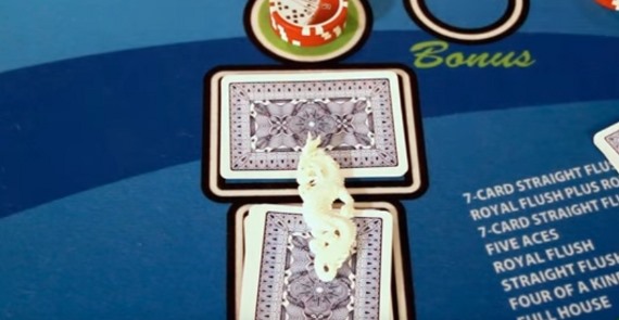 Pai Gow Poker dragon hand marker on top of the dragon hand cards