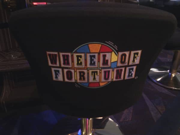 The Wheel of Fortune logo on the back of a chair The Wheel of Fortune logo on the back of a chair