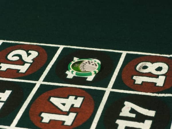 A large stack of chips is on one number on roulette A large stack of chips is on one number on roulette